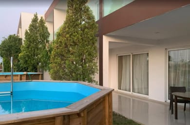 Suite with Round Wood Above Ground Pool
