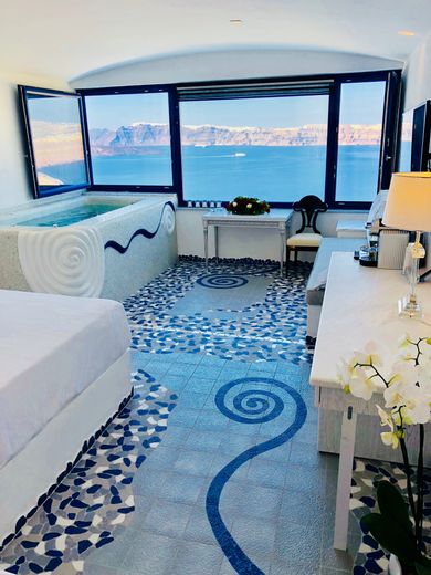 Cave Pool Suite with private cave pool indoor couples Jacuzzi and private panoramic terrace with sea/volcano/caldera views