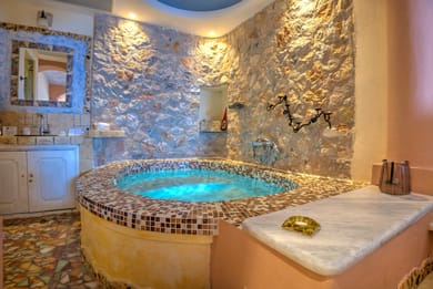 Junior Suite with indoor couples Jacuzzi and private balcony with sea/caldera/volcano view