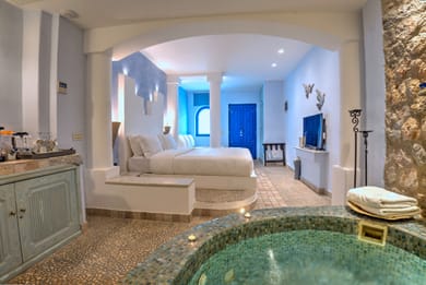 Junior Suite with indoor couples Jacuzzi and private balcony with sea/caldera/volcano view