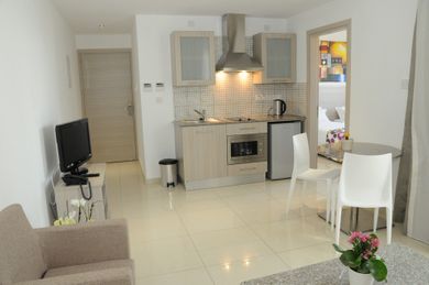 Modern,42m2 spacious suite with sea or inland view. It has a bedroom and a living room combined with kitchenette. Wi-Fi, electronic safe box, heating, air conditioning, satellite TV are all included.