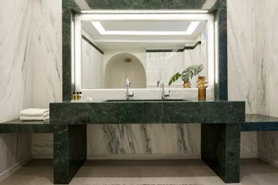 Deluxe Suite with outdoor cave heated jacuzzi and caldera view
