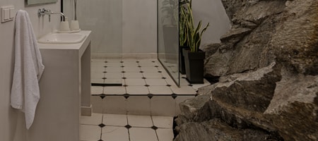 House K | Rock Bathroom | Raised Ground Floor