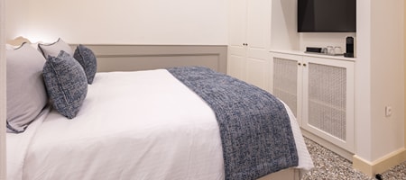 Queen room with window overlooking at adjacent building -  Room 3