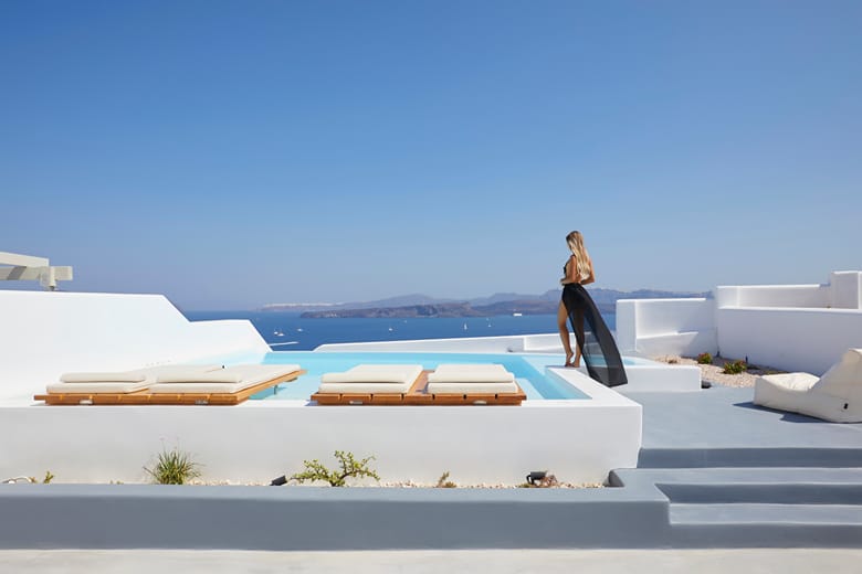 A villa terrace and infinity pool over the caldera